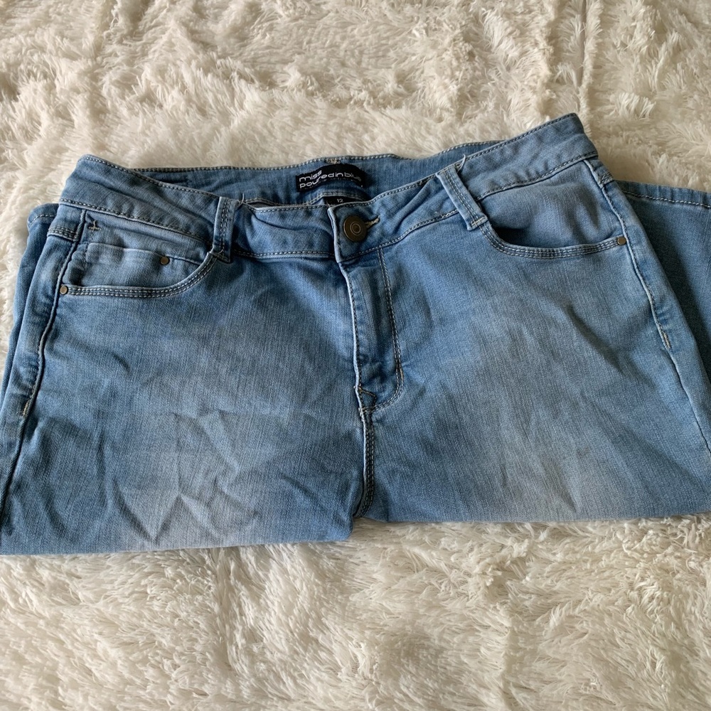 Miss Poured in Blue denim shorts, knee length
